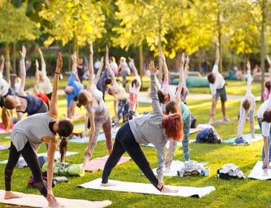 Group yoga session in a park