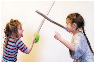 Children playing with toy swords