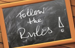 Chalkboard with 'Follow the Rules!'