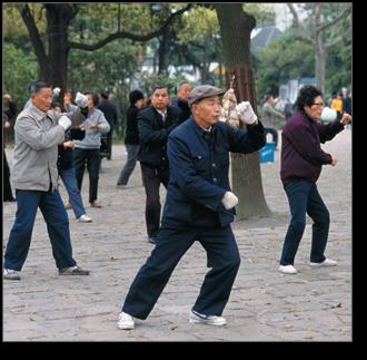 Group practicing Tai Chi, representing cultural influences
