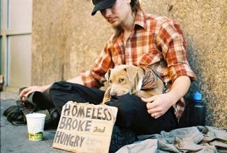 Homeless person with sign