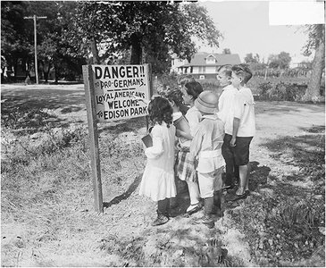 Children viewing anti-German sign in Chicago, 1917