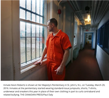 Inmate in prison hallway