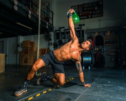Person performing strength exercise, illustrating diversity in physical practices