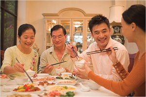 Contemporary Chinese American family sharing a meal