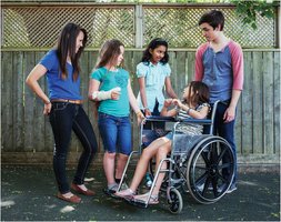 Group of young people, including a girl in a wheelchair, socializing