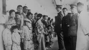 Historical photo of Asian immigrants arriving in the United States