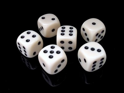 Six-sided dice showing different faces