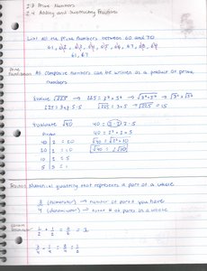 Notebook page with prime factorization and fractions